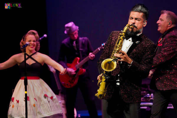 Louis Prima Jr., son of the late musician Louis Prima kneels