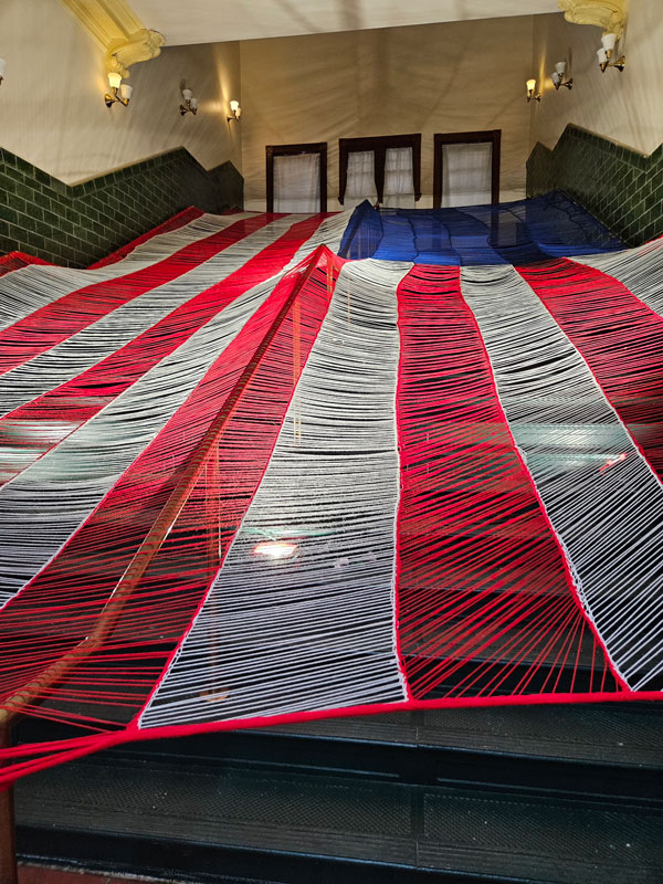 Artist creates a Forty-foot Knitted Flag on view at Liberty State Park in the historic CRRNJ Terminal